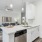 a kitchen with white cabinets