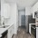 a kitchen with white cabinets
