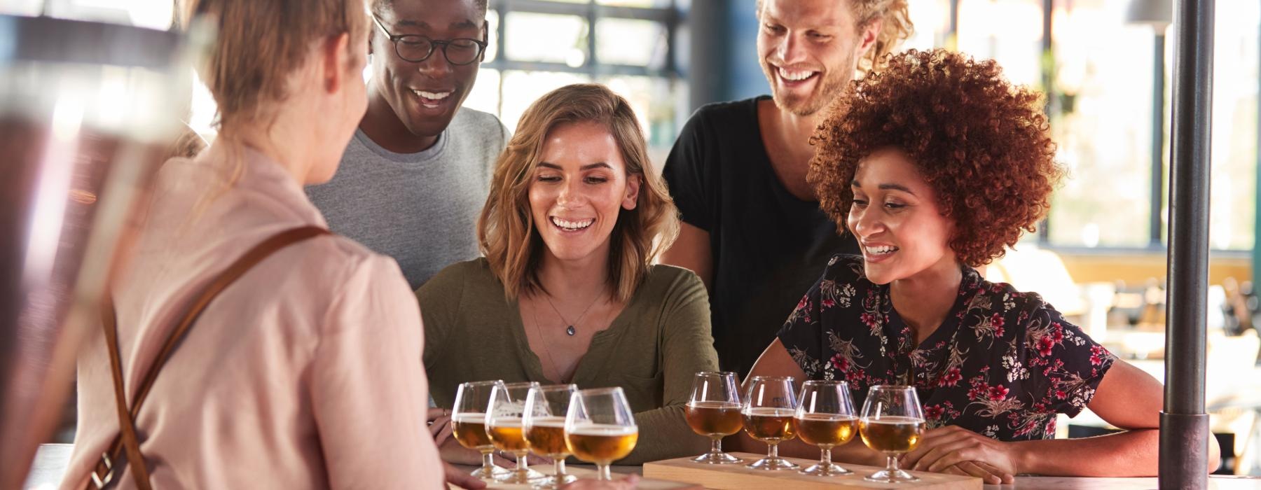 a group of people drinking wine