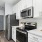 a kitchen with white cabinets