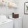 a white laundry room with a white washer and dryer